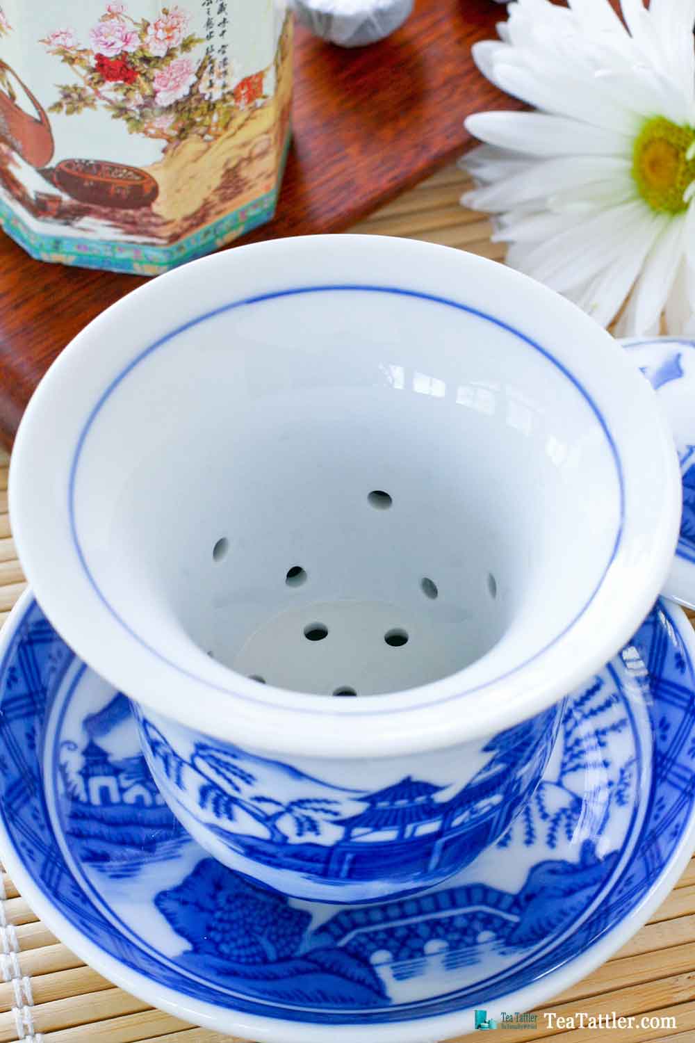 Blue and White Gaiwan with a pattern similar to the Spode Blue Willow pattern. It has a porcelain filter insert suitable for loose leave tea. | TeaTattler.com #gaiwan #liddedbowl