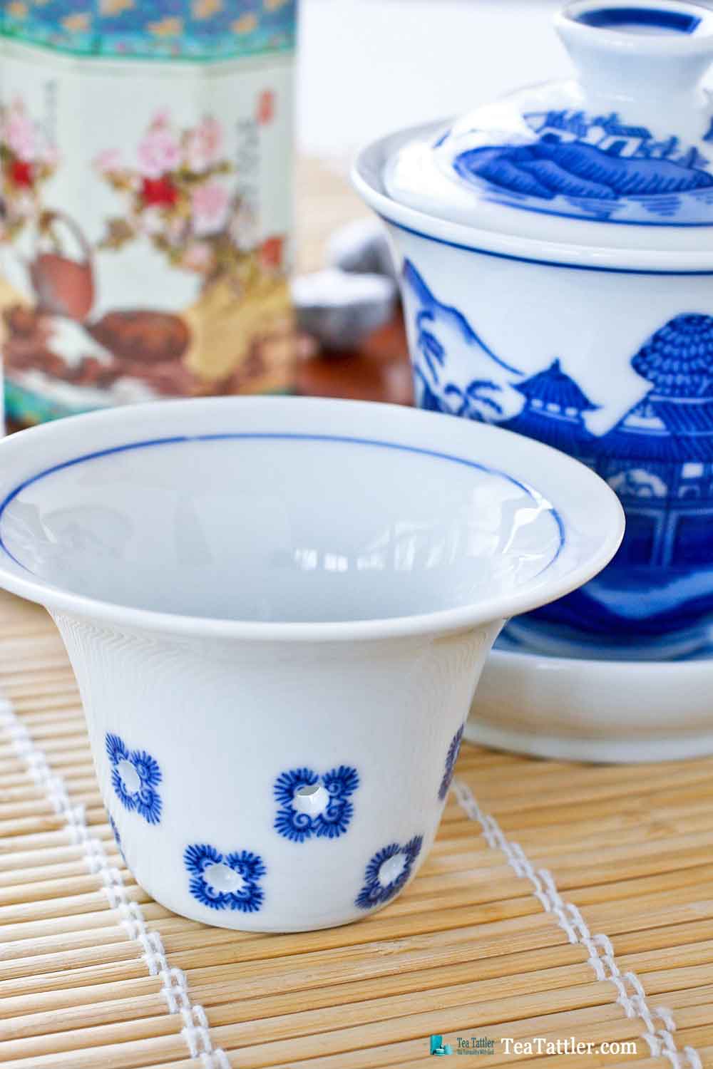Blue and White Gaiwan with a pattern similar to the Spode Blue Willow pattern. It has a porcelain filter insert suitable for loose leave tea. | TeaTattler.com #gaiwan #liddedbowl