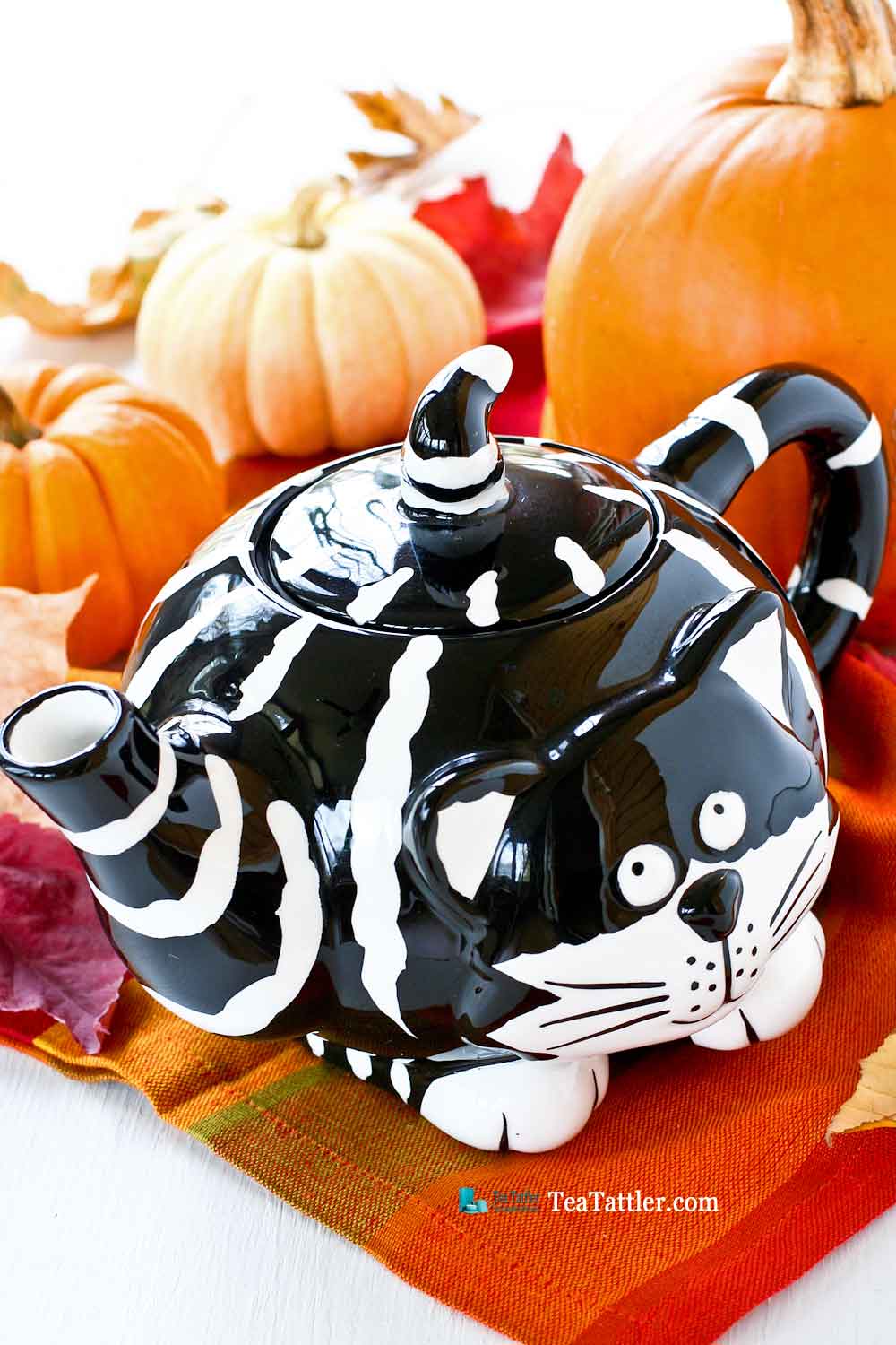 Adorable black and white striped Kitty Teapot named Chester The Cat . The finial is its pointy tail. Perfect for a theme tea party. | TeaTattler.com #kittyteapot #chesterthecat