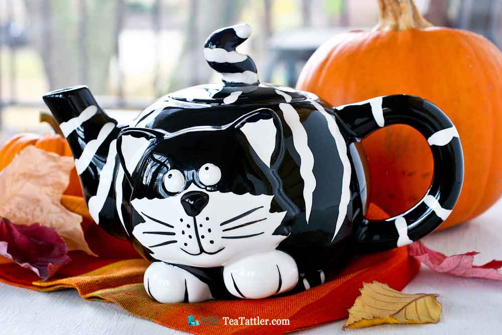 Adorable black and white striped Kitty Teapot named Chester The Cat . The finial is its pointy tail. Perfect for a theme tea party. | TeaTattler.com #kittyteapot #chesterthecat