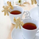 These fun and tasty Cup-Adorning Lemon Cookies are able to cling to the side of your teacup or mug. A delight for all occasions. | TeaTattler.com #cupadorninglemoncookies #lemoncookies